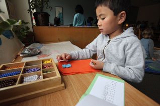 Young boy working on puzzle